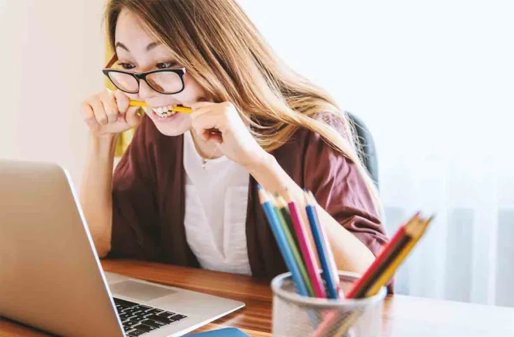 Student Loan Payments - Student Biting Pencil