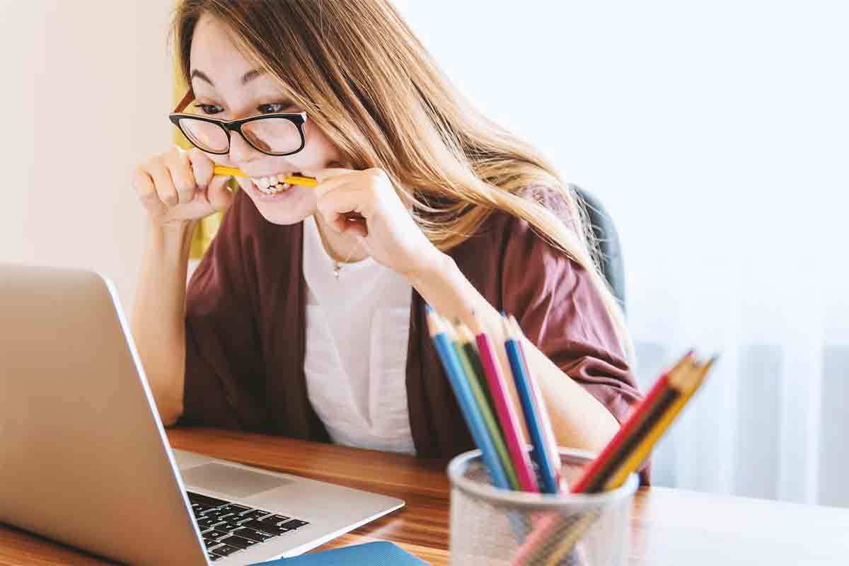 Student Loan Payments - Student Biting Pencil